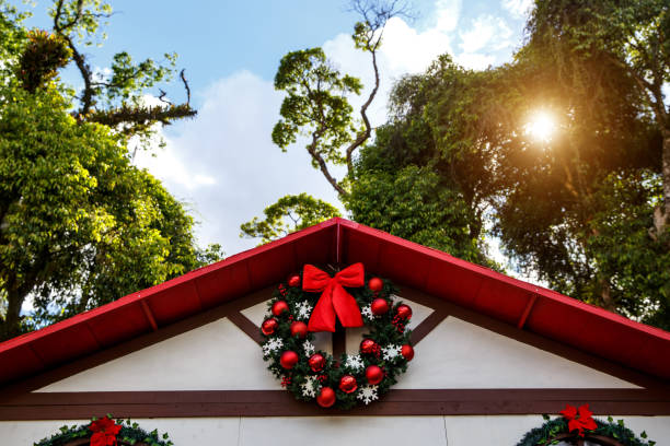 istock Christmas decorations - wreath with balls on a summer background 1348144746