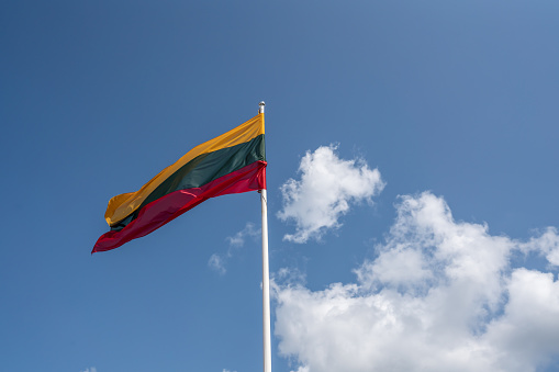 Lithuanian Flag on a blue sky with clouds - Lithuania