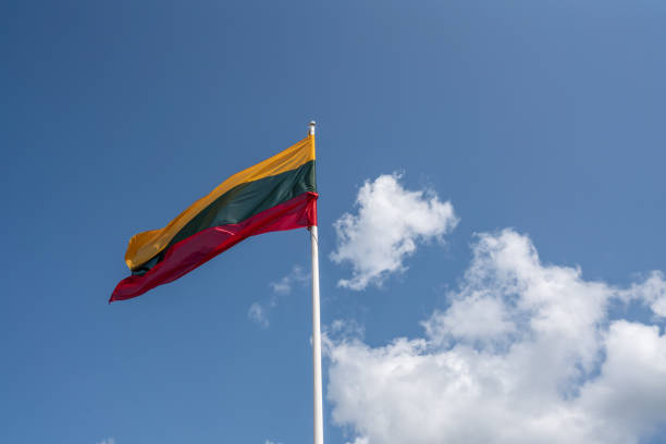 Lithuanian Flag on a blue sky with clouds - Lithuania stock photo