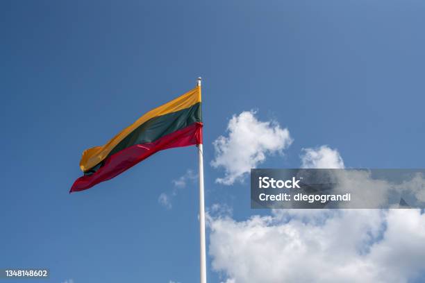 Lithuanian Flag On A Blue Sky With Clouds Lithuania Stock Photo - Download Image Now