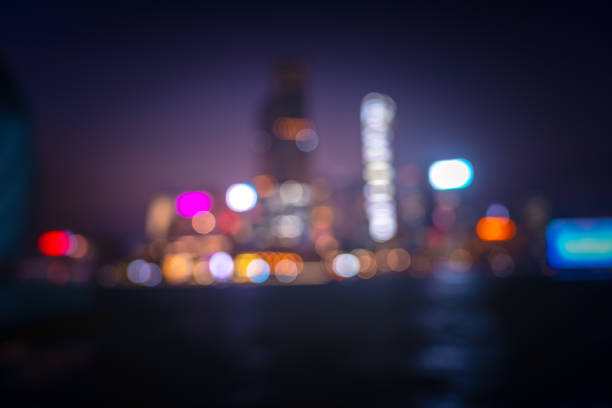 istock Abstract colorful circular bokeh with city background 1348148992
