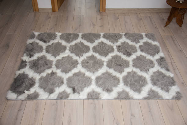 istock Laminate parquete floor. Light wooden texture. soft carpet. Warm interior design 1348149760