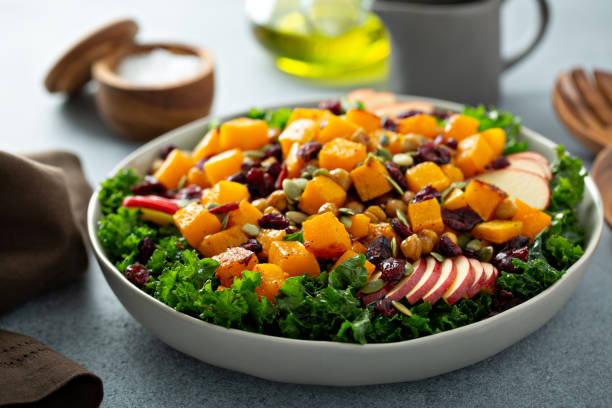 istock Fall salad with kale, roasted squash and apples 1348158782