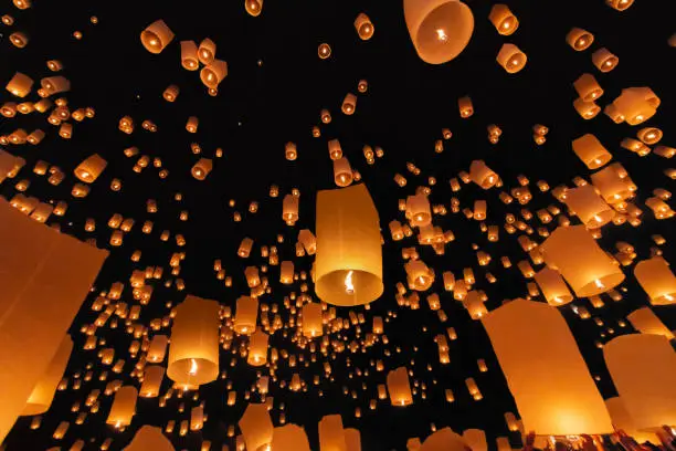 Tourist floating sky lanterns in Loy Krathong festival , Chiang Mai ,Thailand.