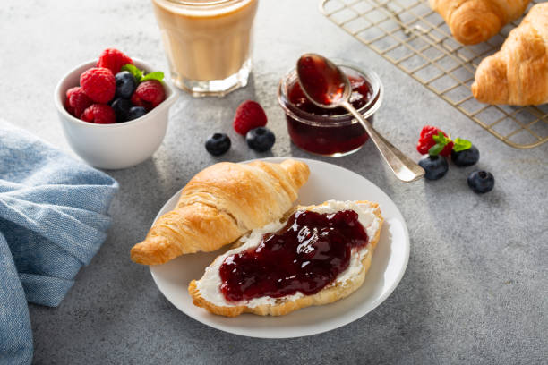 istock Fresh summer breakfast with croissants and berry jam 1348158890