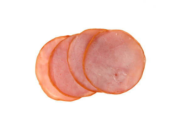 istock Pork ham slices isolated on white background 1348161436