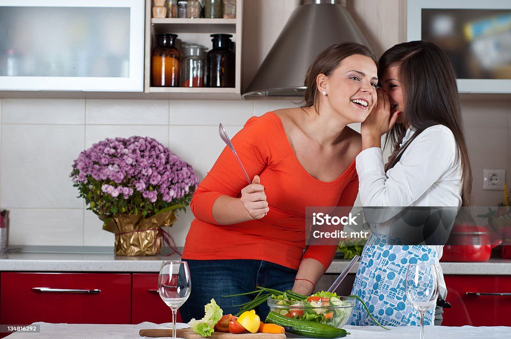 two friends preparing salad together two young girls preparing salad together 18-19 Years Stock Photo