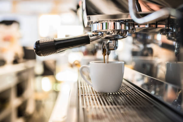 istock Close-up of making espresso from a coffee machine. Professional coffee brewing 1348168087