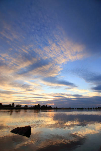 istock Colorful sunset by the Odra River, Poland. 1348171128