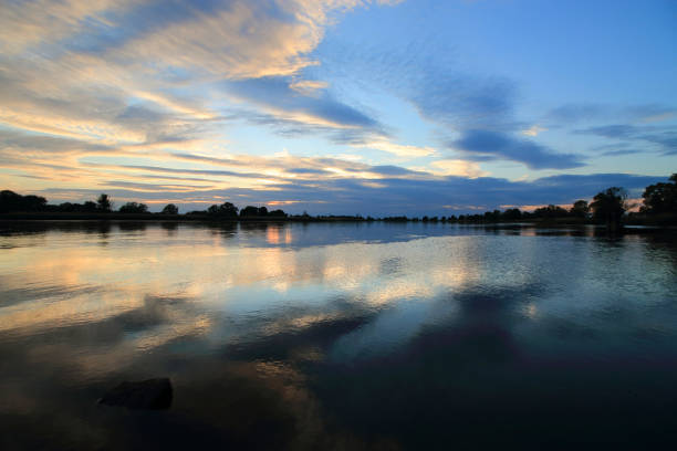 istock Colorful sunset by the Odra River, Poland. 1348171135