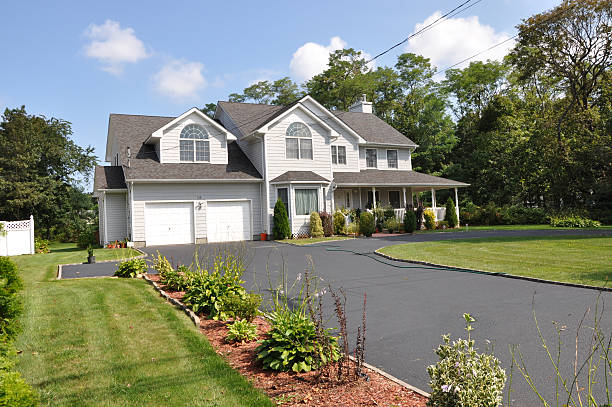 Suburban Home with Long Driveway Two Car Garage stock photo