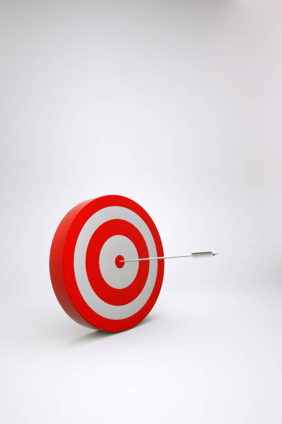 istock Realistic 3D model of a red target with a dart in the middle on a white isolated background. Red target, target, darts game. 3D graphics 1348175822