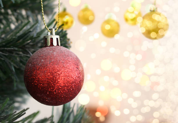 istock Red Christmas ball hanging on Christmas tree with bokeh 1348177157