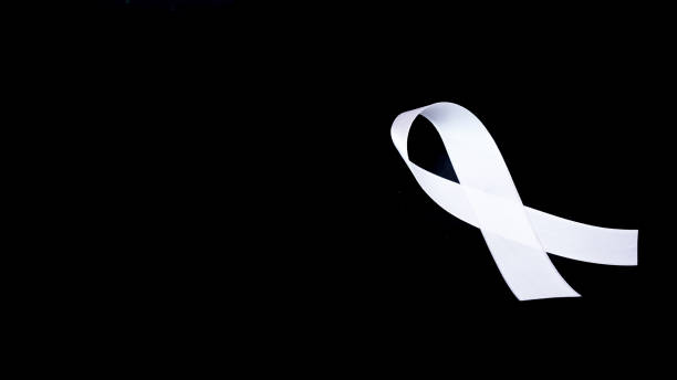 istock A white awareness ribbon on black background for peace condition 1348185031