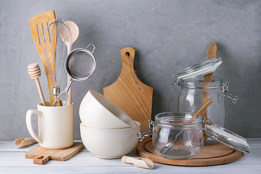 Close-up of kitchen utensils and containers made of wood, metal and glass. Eco-friendly materials, no plastic concept. Selective focus.