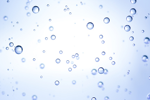 Oil bubbles in water, abstract  background.