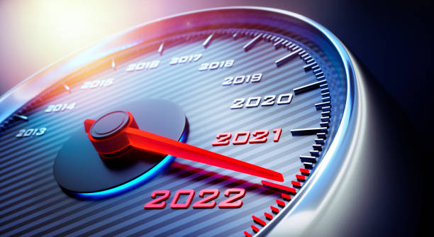 Speedometer 2021 2022 Dark stylish speedometer with needle moving to the year 2022 meter instrument of measurement photos stock pictures, royalty-free photos & images