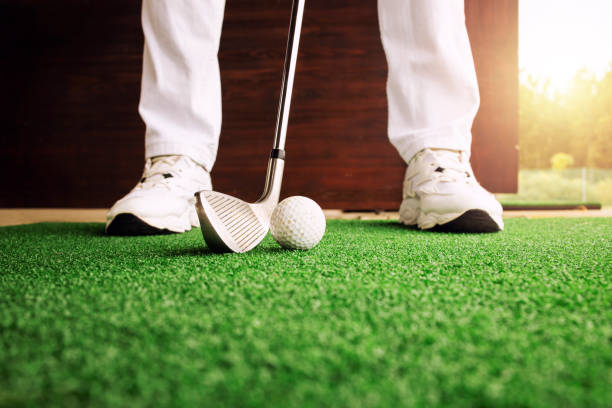 istock Golfer preparing to hit the ball at golf course. 1348192338
