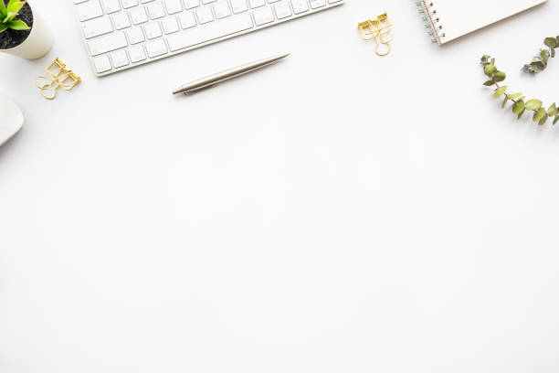 istock White office desk table with computer tools and office supplies. Top view with copy space, flat lay. 1348195133