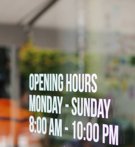opening hours shop window white decal sticker monday to sunday 8am to 10pm - poster window display store window imagens e fotografias de stock