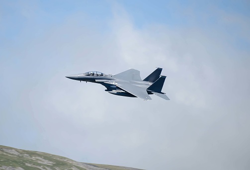 Military Aircraft in Flight. RAF F-15 Strike Eagle Low Level Attack and Evasion Training North Wales Mountains.UK
