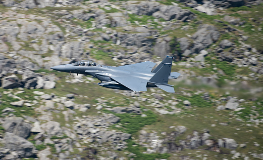 Military Aircraft in Flight. RAF F-15 Strike Eagle Low Level Attack and Evasion Training North Wales Mountains, UK