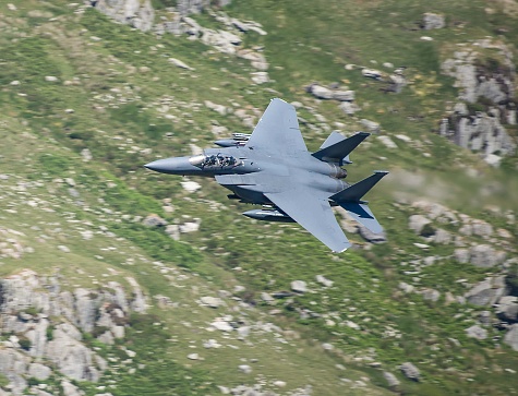 Military Aircraft in Flight. RAF F-15 Strike Eagle Low Level Attack and Evasion Training North Wales Mountains, UK