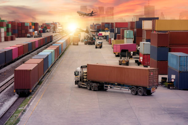 istock Logistics import export background and transport industry of forklift handling container box loading at seaport 1348201184