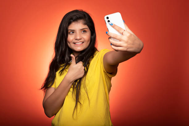 istock Young woman using mobile phone stock photo 1348201247