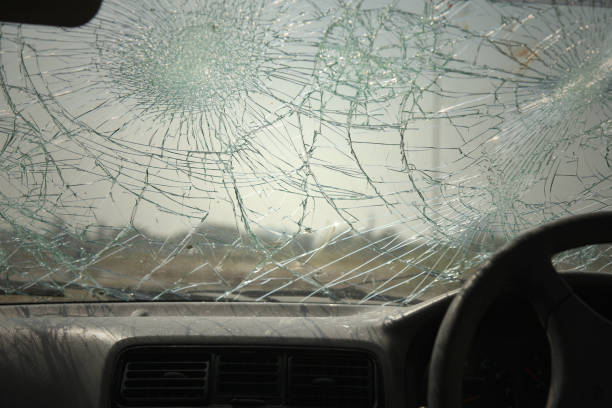 istock Inside of car with the broken windshield during road accident 1348203800