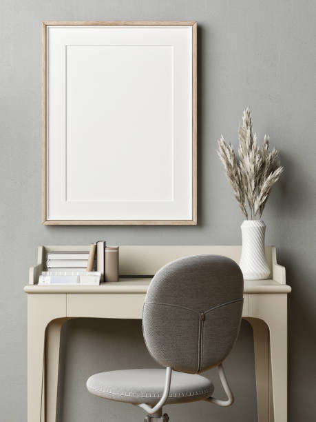 istock A home workplace with a mock-up poster for product presentation.modern table, chair, and decoration in front of gray mortar wall background. 1348203821