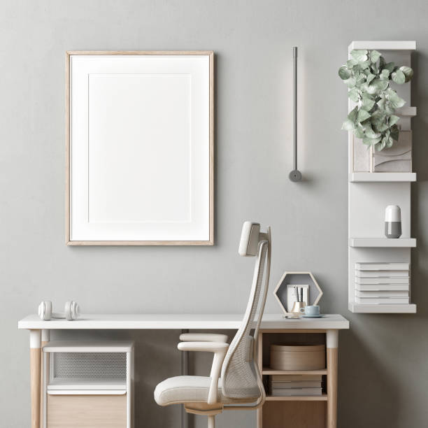 istock A home workplace with a mock-up poster for product presentation.
modern table, chair, and decoration in front of gray mortar wall background. 1348203826