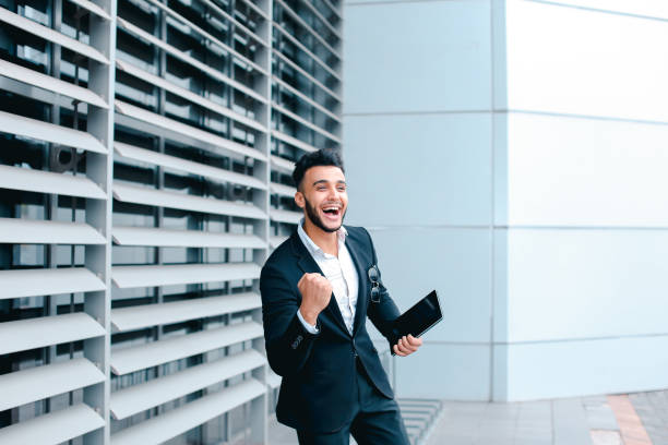 istock Young arabic man demonstrate shows YES business center 1348204782