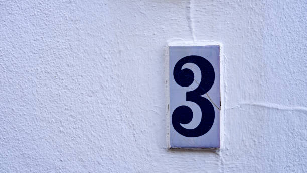 istock ceramic house number table. number: 3. on a white background 1348205735
