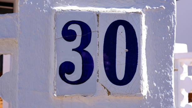 istock ceramic house number table. number: 30. on a white background 1348205737