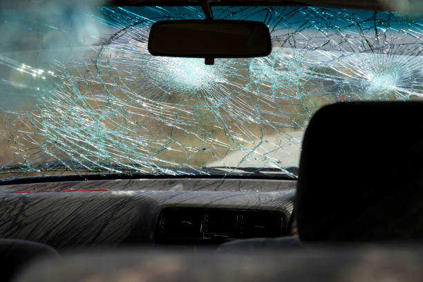 istock Inside of car with the broken windshield during road accident 1348206777