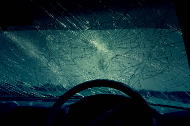 istock Inside of car with the broken windshield during road accident 1348208932