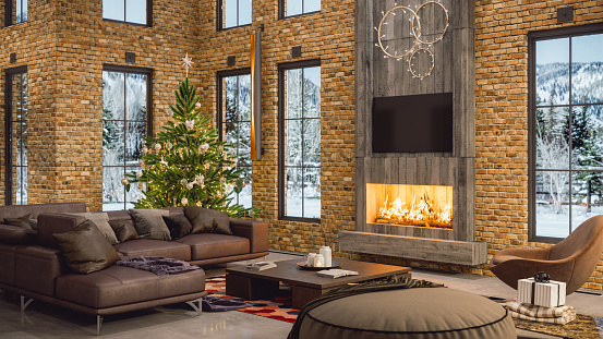 Fireplace, Christmas tree and presents in a luxurious chalet with snowy mountain view.