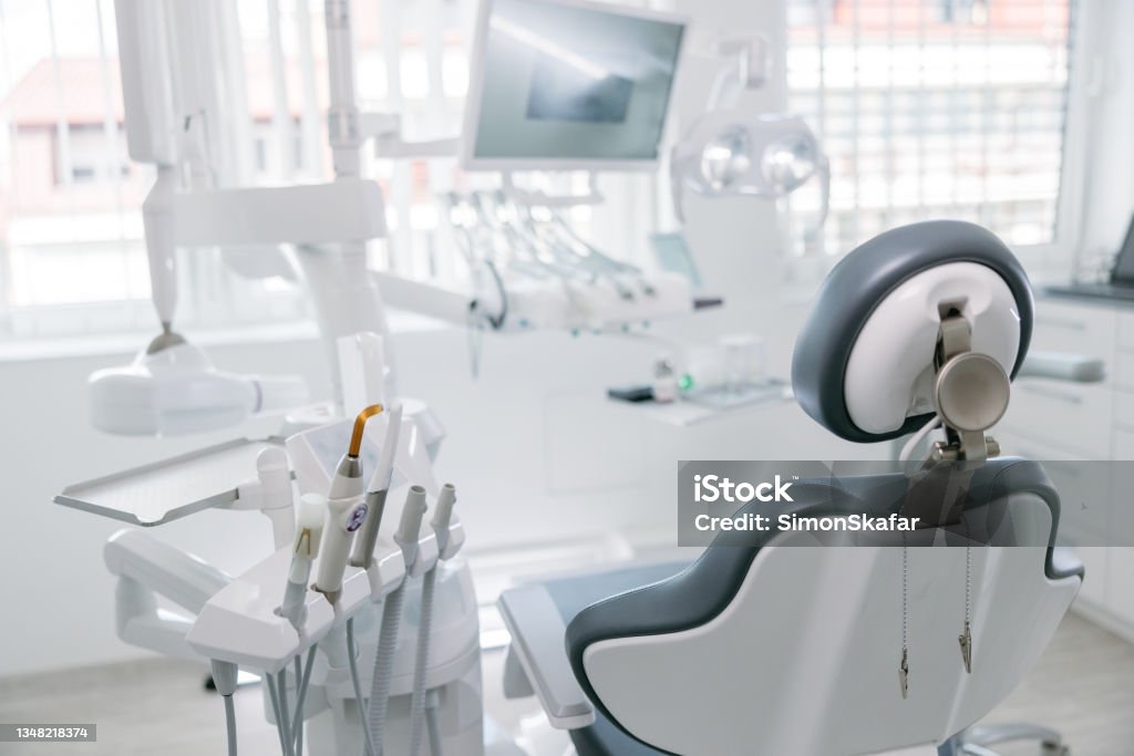Modern dental drills and empty chair in the dentist's office Modern dental drills and empty chair in empty dentist's office Dentist's Office Stock Photo