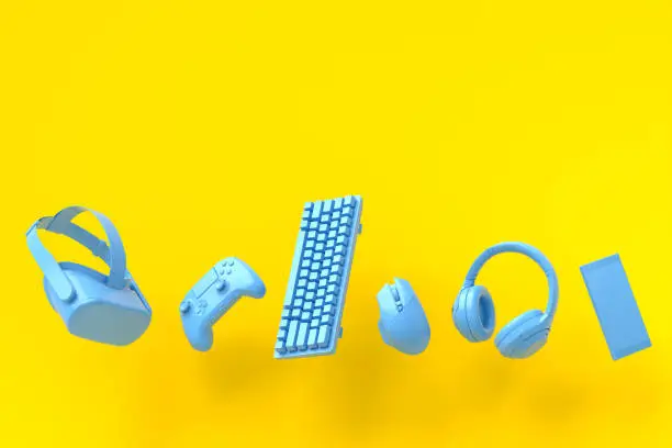 Flying gamer monochrome blue gears like mouse, keyboard, joystick, headset, VR Headset on yellow table background. 3d rendering of accessories for live streaming concept top view