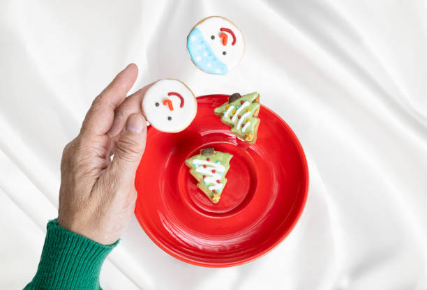 istock A hand with levitating Christmas cookies. 1348222387