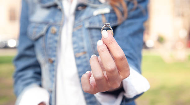 istock Young woman showing her engagement ring. 1348223844