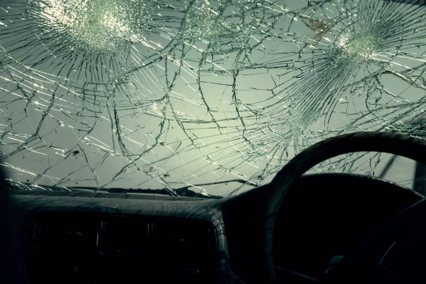 istock Inside of car with the broken windshield during road accident 1348229015