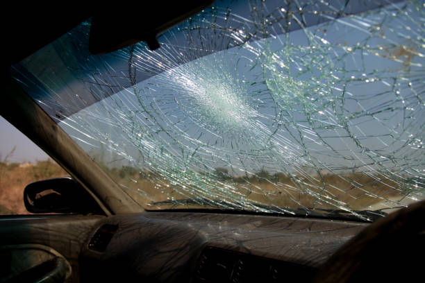 istock Inside of car with the broken windshield during road accident 1348229016
