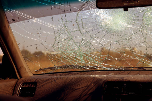 istock Inside of car with the broken windshield during road accident 1348229017