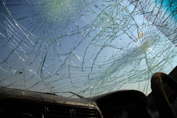 istock Inside of car with the broken windshield during road accident 1348229018