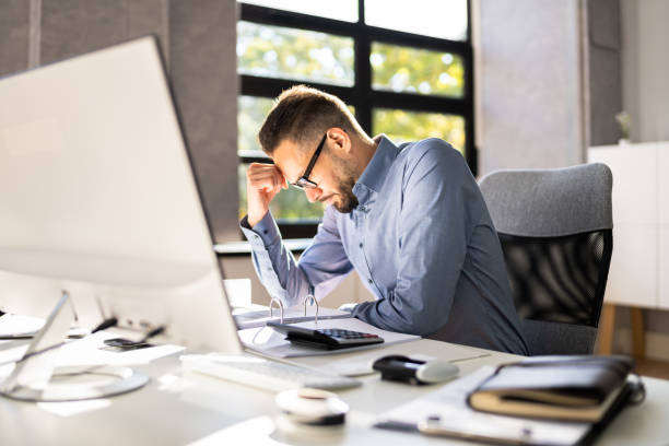 istock Stressed Tired Business Accountant Man 1348229055