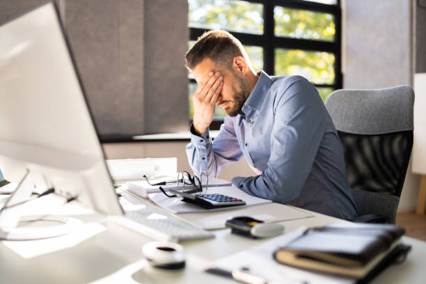 istock Stressed Tired Business Accountant Man 1348229063