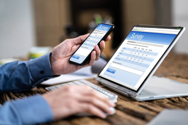 istock Businessman Giving Online Survey On Digital Tablet 1348229436