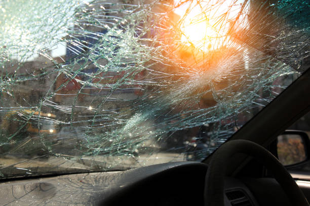 istock Inside of car with the broken windshield during road accident 1348230769